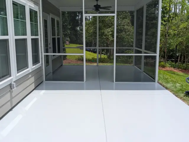Light finished floor opening onto a screened porch