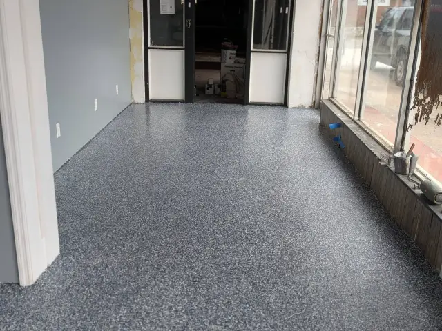 Flake floor in a storefront with tall street windows