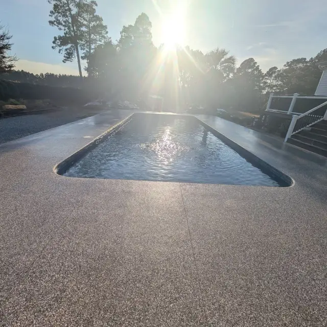 Coated pool deck in late-afternoon sun