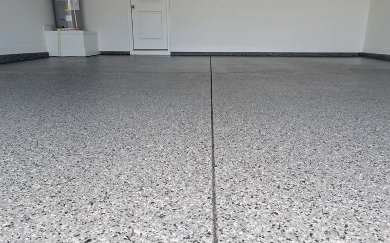 Close view of a flake floor along a garage joint