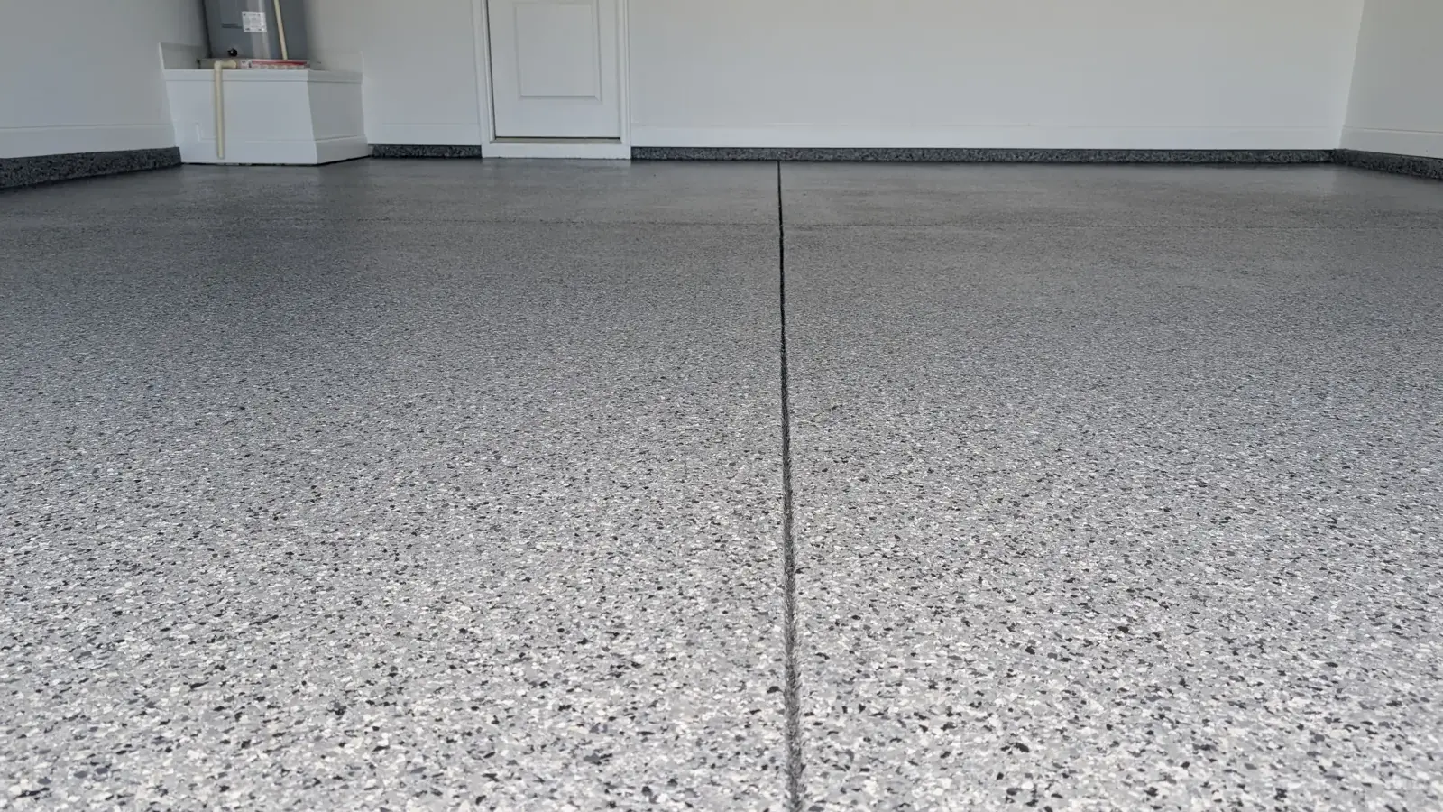 Close view of a flake floor along a garage joint