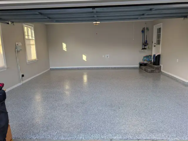 Glossy light flake floor in a bright two-car garage