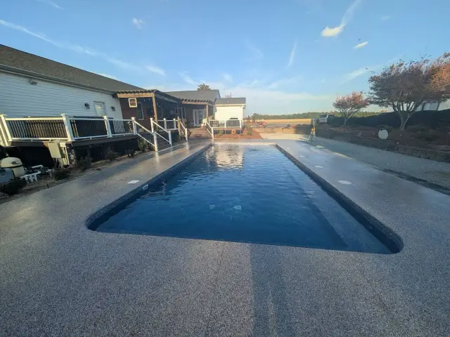 Pool deck with a long rectangular pool