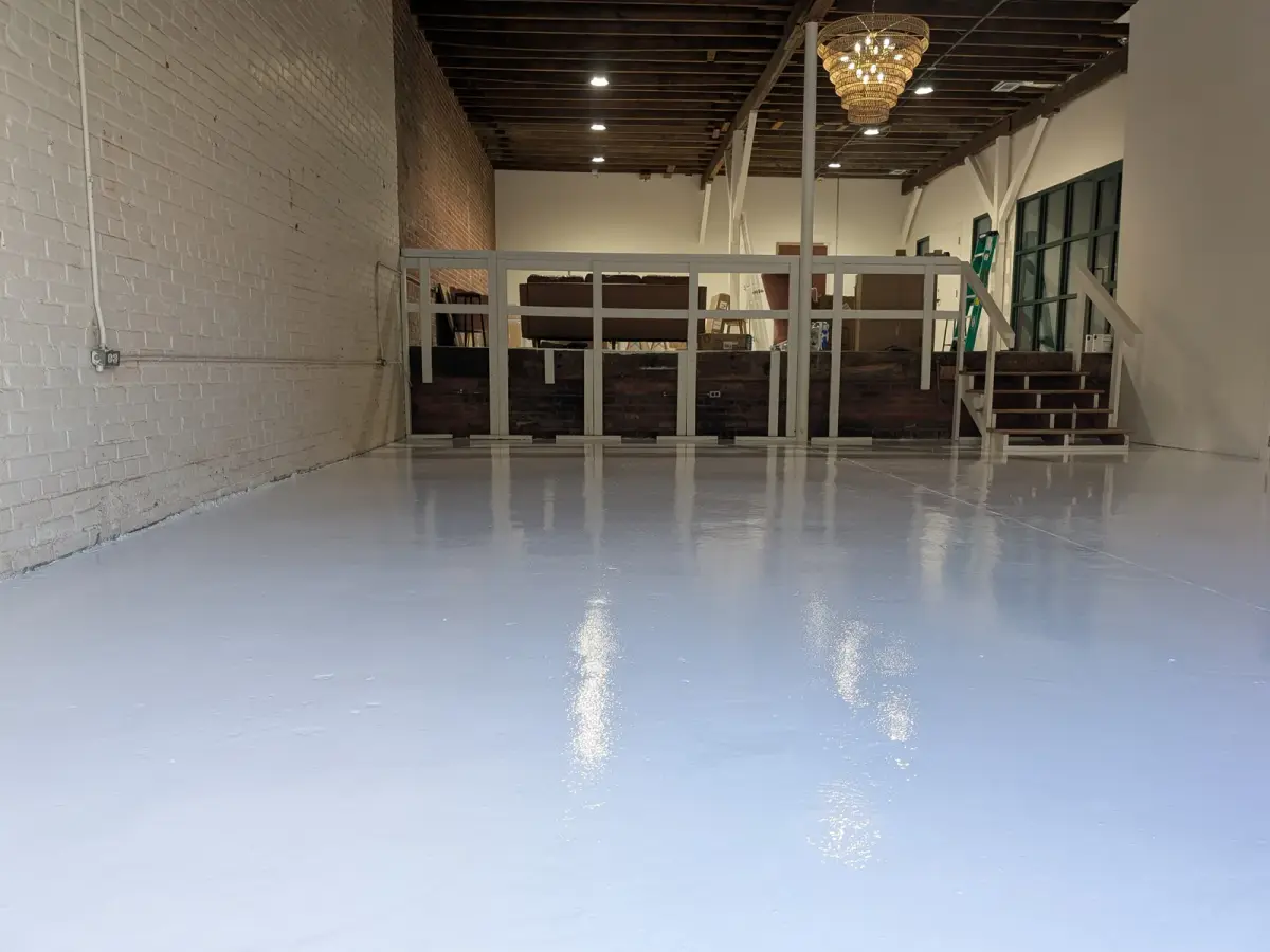 Glossy white solid-color floor in a commercial space