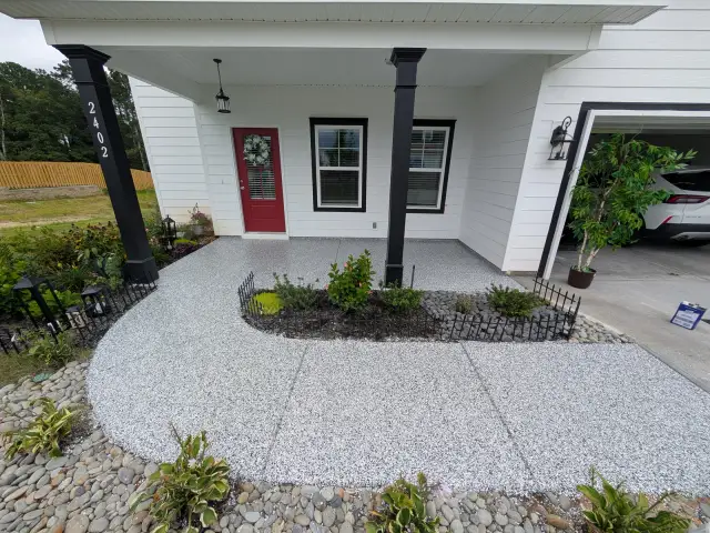 Flake front walkway curving through landscaping