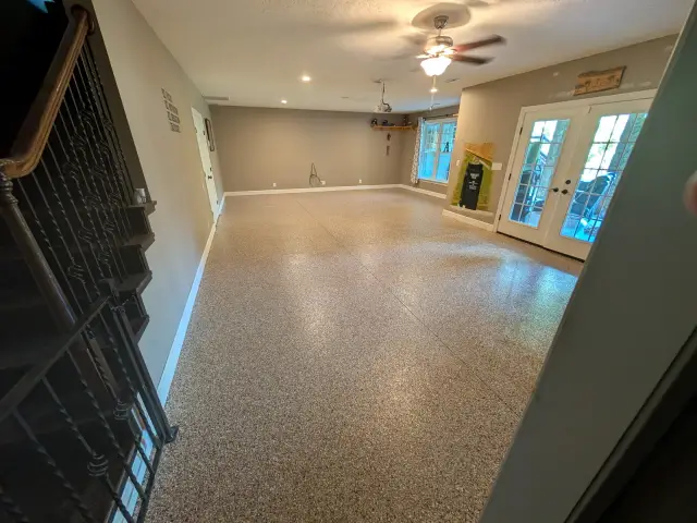 Flake floor in a living space beside a staircase