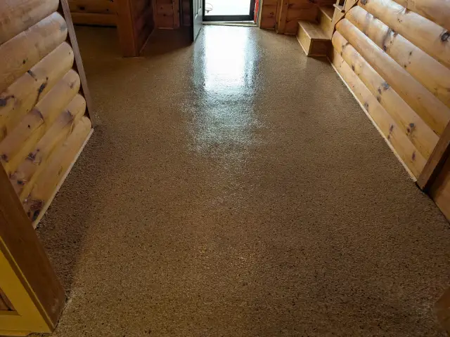 Glossy flake floor in a wood-paneled room