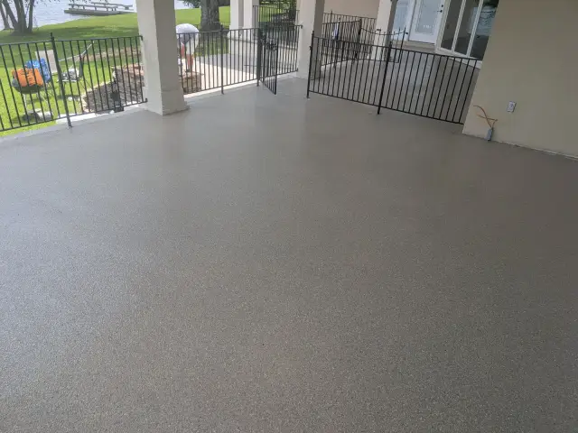 Flake back patio with an iron railing
