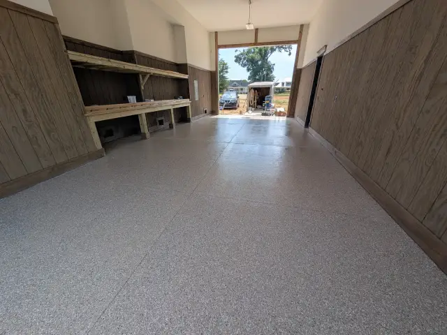 Coated shop floor with wood-lined walls