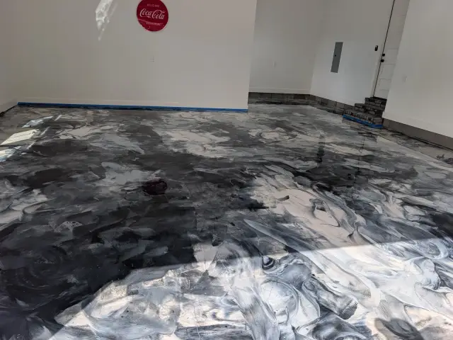 Black and silver metallic floor, mid-installation