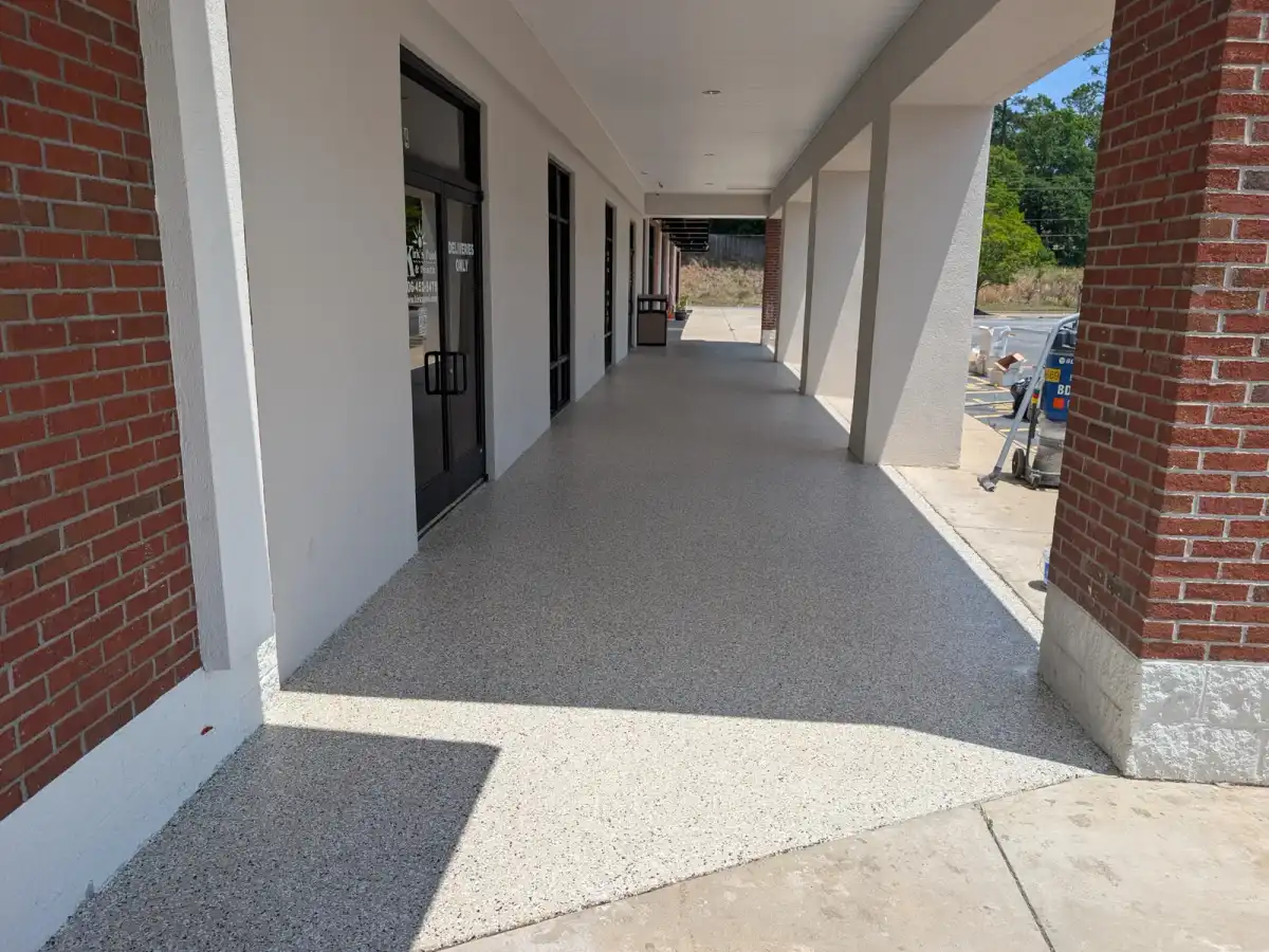 Light flake walkway along a covered brick porch