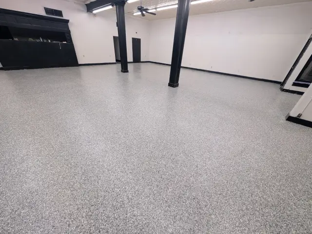 Gray flake commercial floor with steel columns