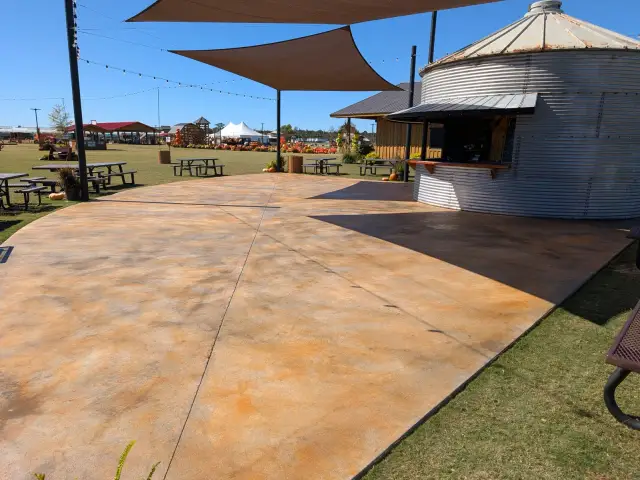 Warm-toned stained surface at an outdoor gathering area